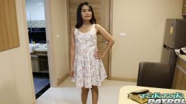 Beautiful Thai babe in white dress take a picture