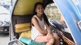 Pretty Pinay sits in a trike in the Philippines