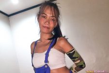 Slender Pinay whore poses for camera in blue overalls