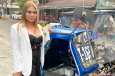 Chubby Asian babe poses next to trike in the Philippines