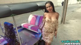 Pretty Thai babe poses next to tuktuk