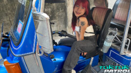Pretty Thai teen poses for camera in tuktuk