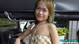 Pretty Thai babe poses in tuktuk for photo