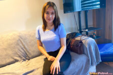 Filipina babe poses on couch in hotel