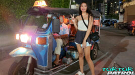 Hot Asian Teen poses next to tuktuk