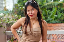Pretty Filipina poses for camera outdoors