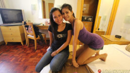 Two skinny Filipina models pose in bedroom