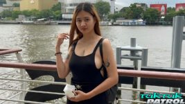 Pretty Thai poses near the river in Thailand