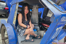Filipina slut sits in trike for photo