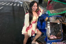 Thick Asian poses next to trike in Manila