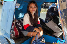 Pretty Filipina teen sits in trike