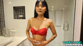 Pretty Thai poses in red bra