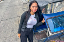 Busty Asian poses next to Philippine trike