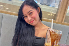 Pretty Filipina smiles for camera at local mall