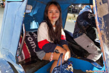 Filipina teen rides a trike