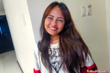Joyful Filipina teen smiles in hotel