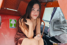 Filipina beauty poses inside trike