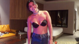 Thai babe poses in black bra