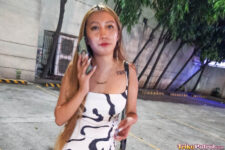 Pretty Pinay on phone on Manila streets