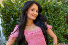 Pretty Asian poses outside